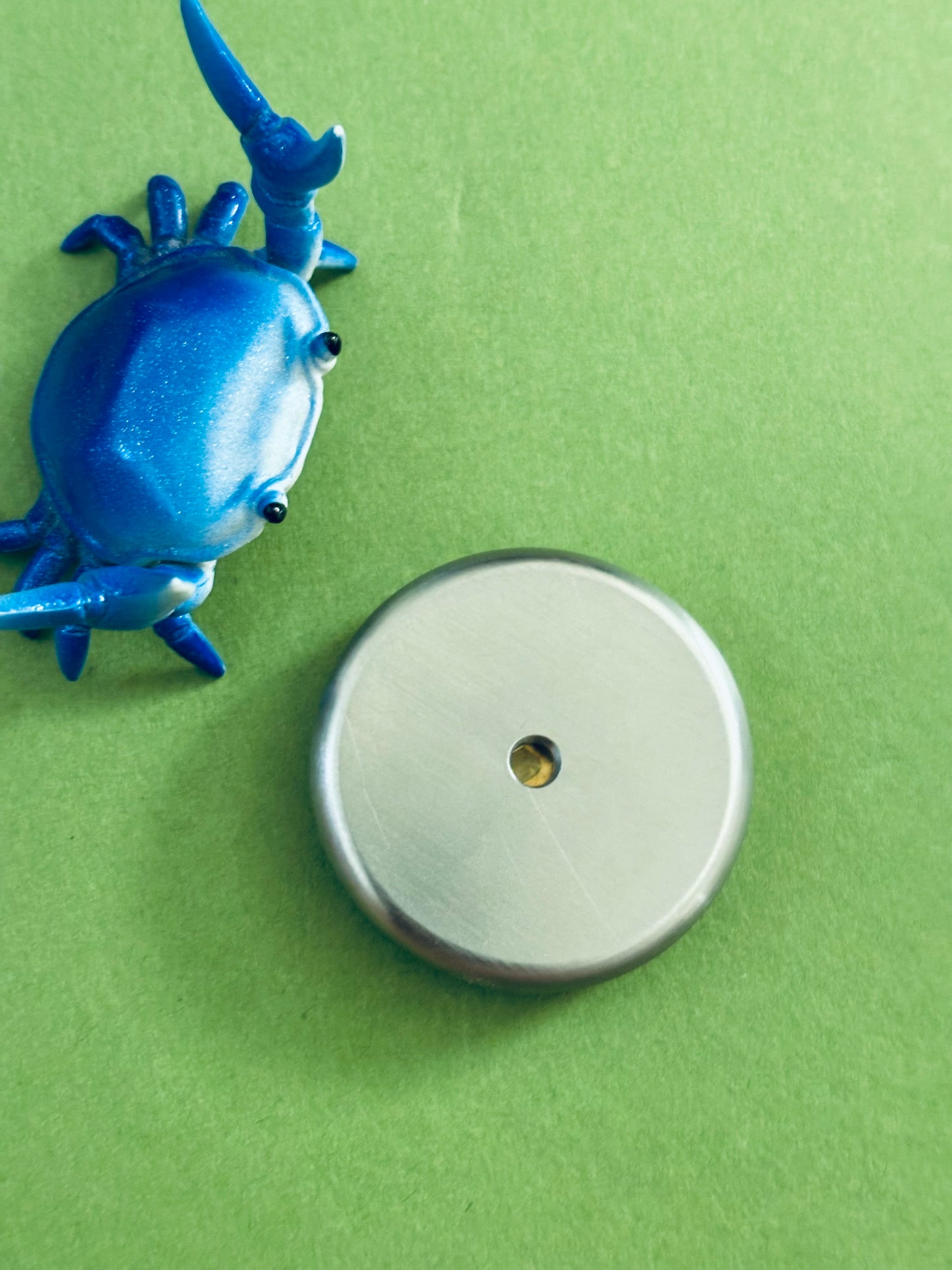 Umburry armored haptic coin - mid size ti/brass- haptic coin - fidget toy