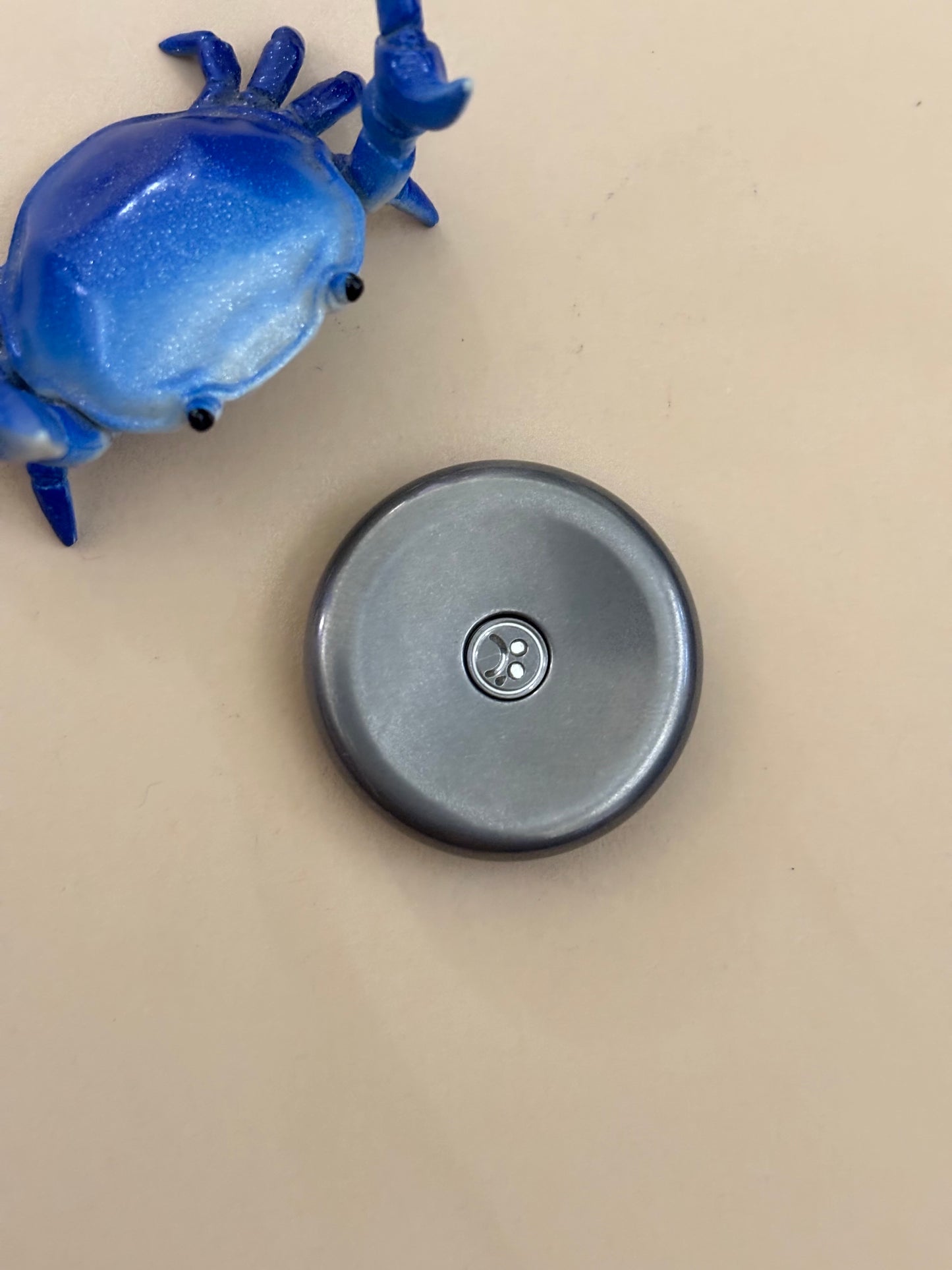 Topc - SS - haptic coin / worry stone