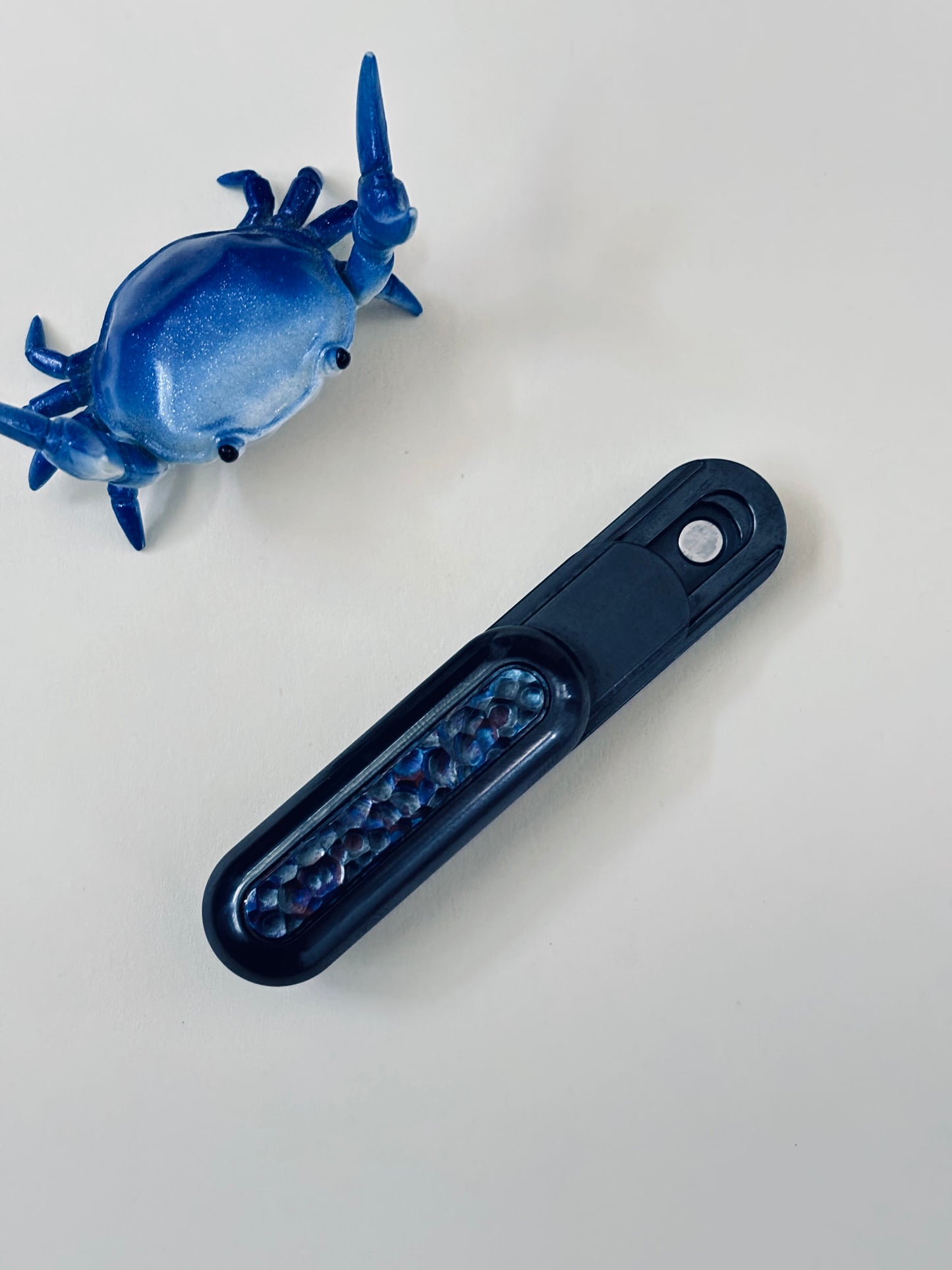 01edc - pod - L zirc/mokuti slider - fidget slider