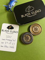 Black cloud creation haptic coin - brass monkey tail - haptic coin