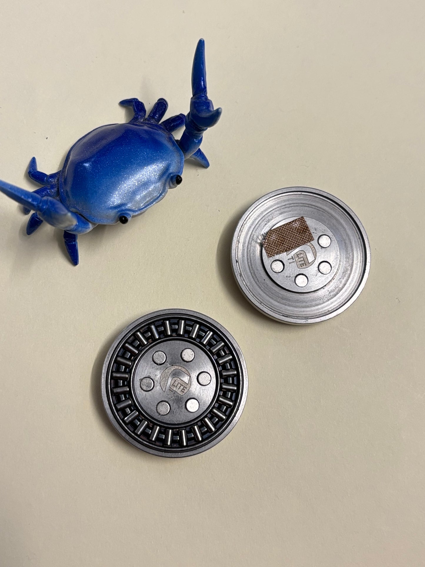 Umburry haptic coin - TI - haptic worry stone