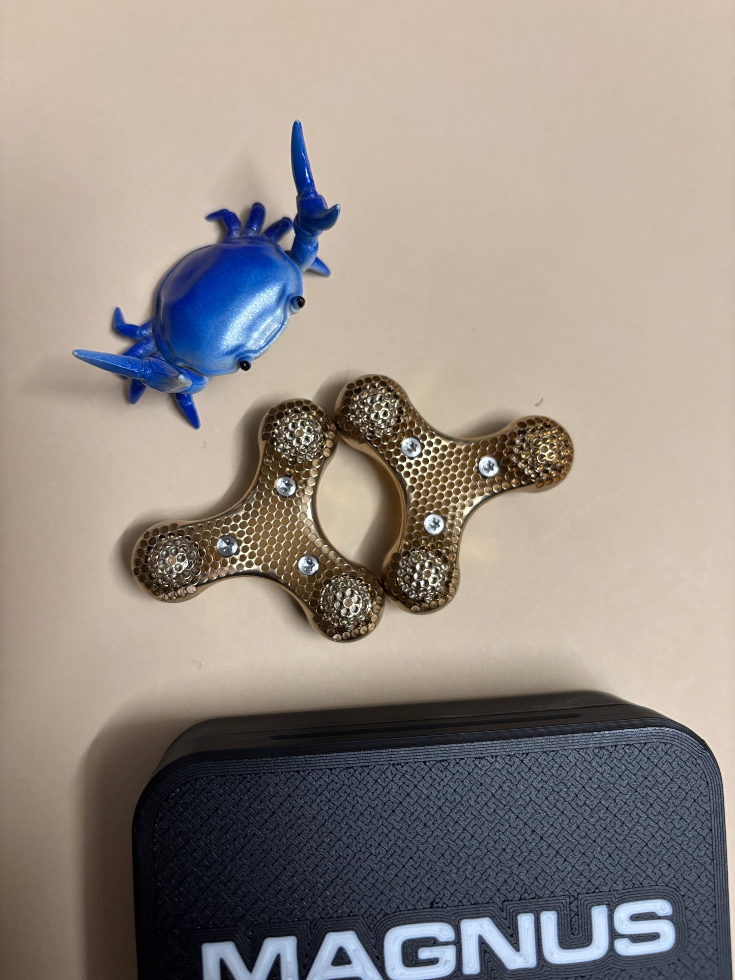 Magnus - atom - skelly - brass - fidget toy
