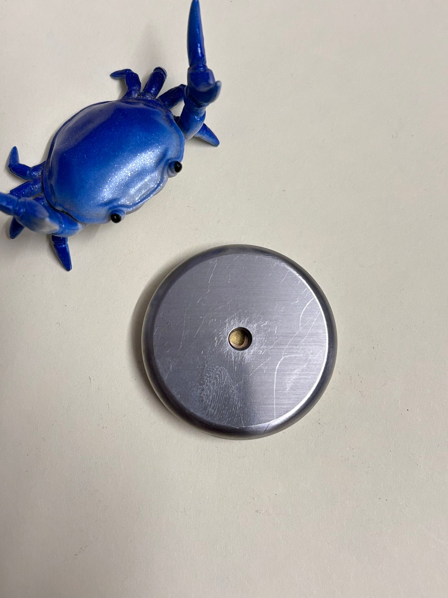 Umburry armored haptic coin - mid size ti/brass- haptic coin - fidget toy