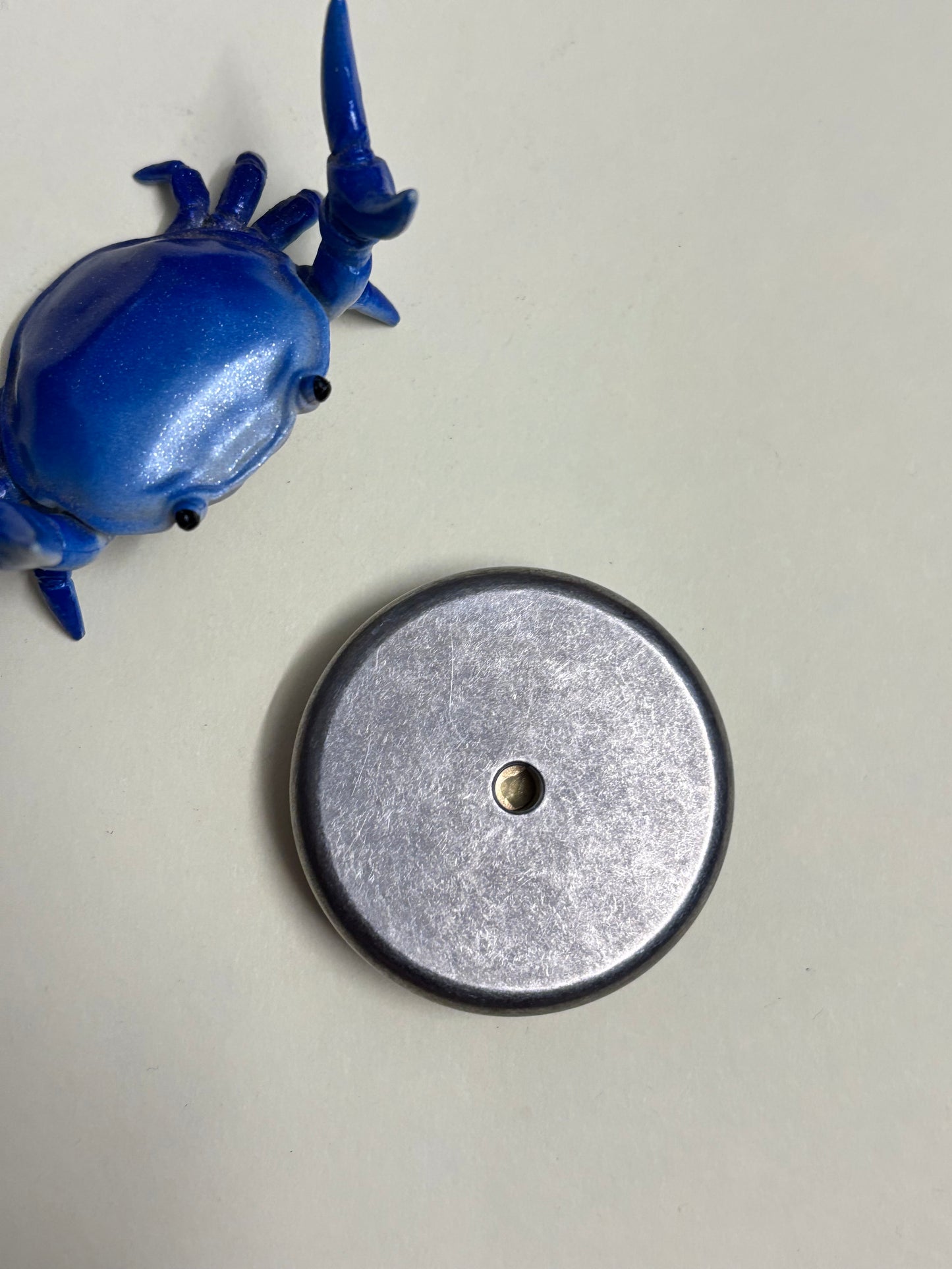 Umburry armored haptic coin - mid size ti/brass- haptic coin - fidget toy