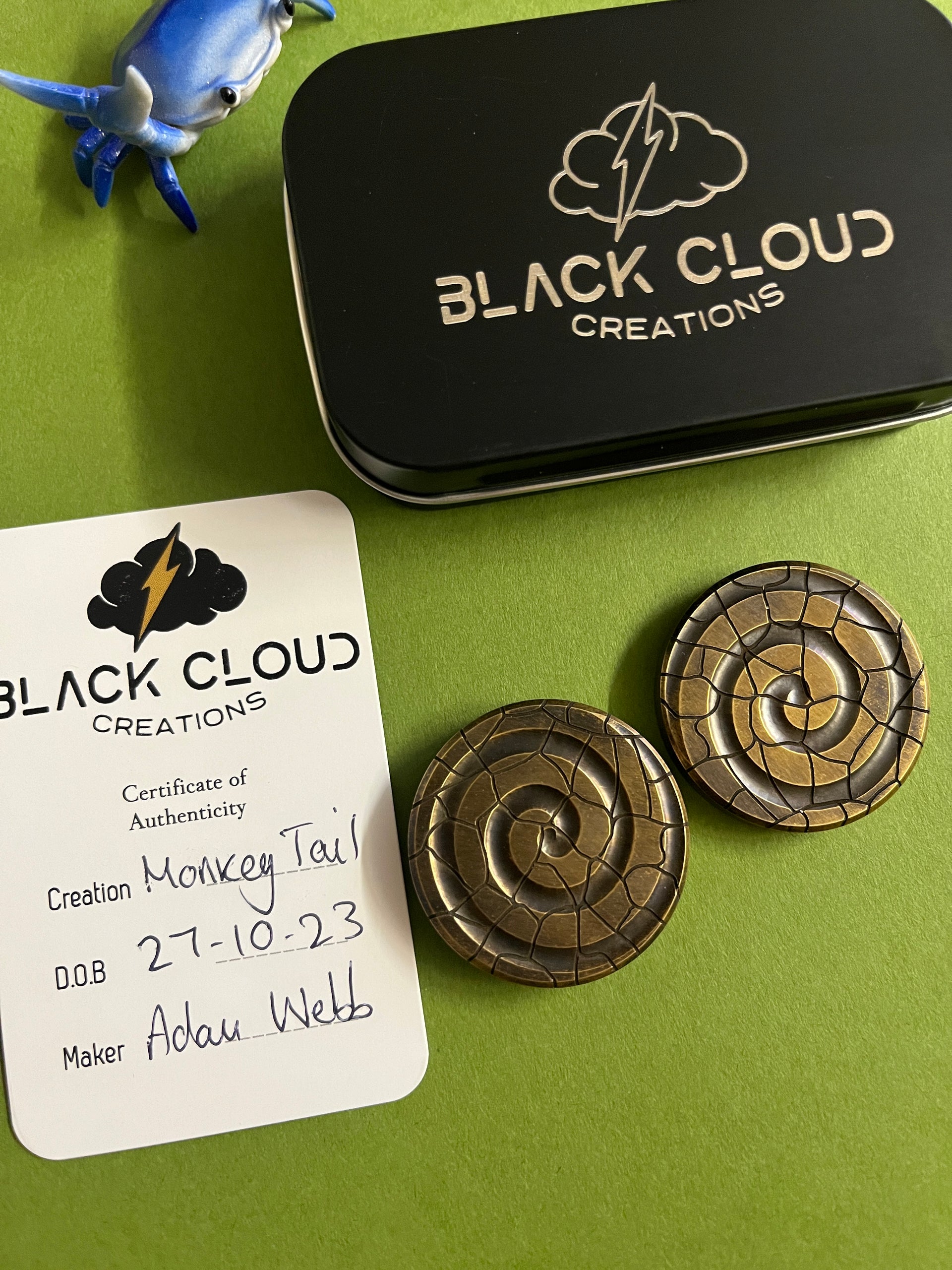 Black cloud creation haptic coin - brass monkey tail - haptic coin
