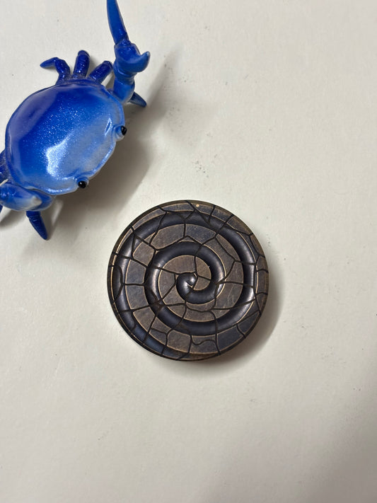 Black cloud creation haptic coin - brass monkey tail - haptic coin