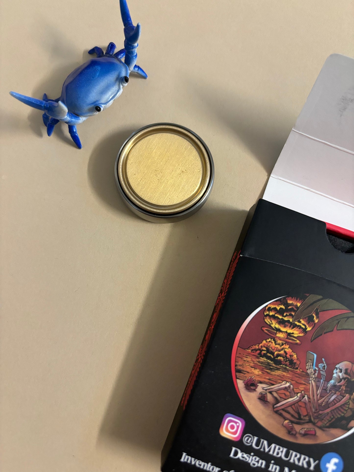 Umburry armored haptic coin - mid size ti/brass- haptic coin - fidget toy