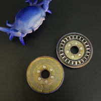 Umburry - crystal titanium redux - midsize - haptic coin - fidget toy