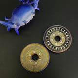 Umburry - crystal titanium redux - midsize - haptic coin - fidget toy