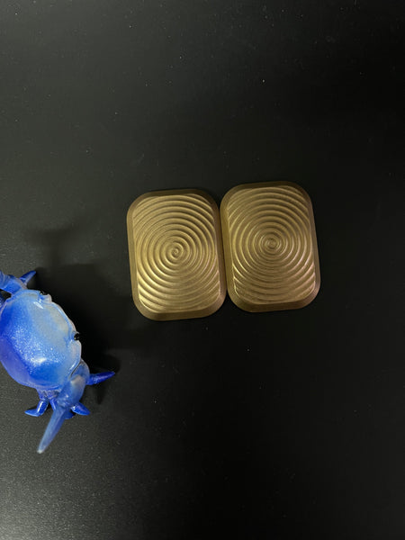 Magnus brass - swirl slider with zirc epoxy plates